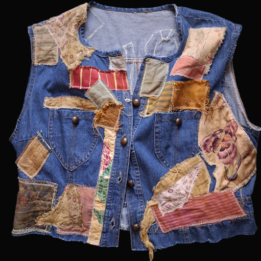 Patchwork denim vest with colorful fabric patches on a handmade